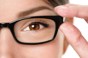 close up brown eye wearing glasses