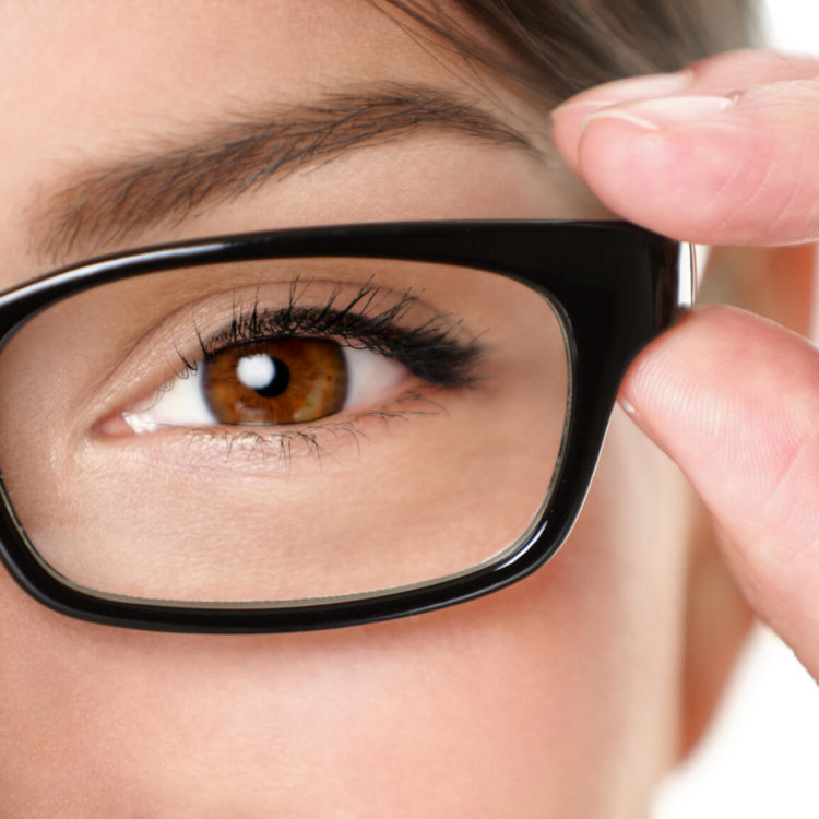 close up brown eye wearing glasses